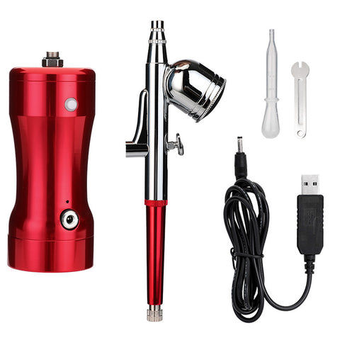 Manicure. Beauty. Cake coloring. Hand-held air pump charging portable airbrush